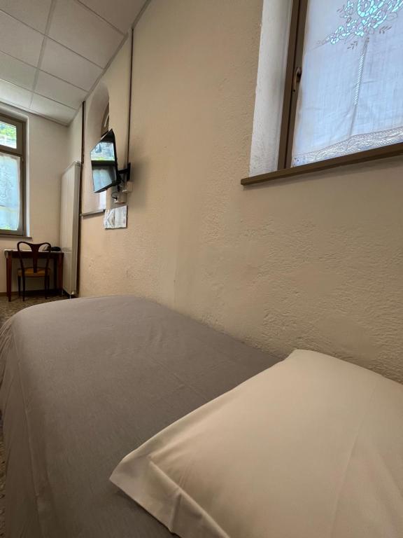 Postel nebo postele na pokoji v ubytování foresteria ca' mon