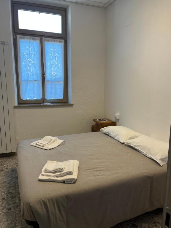 Postel nebo postele na pokoji v ubytování foresteria ca' mon