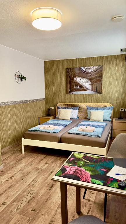 Postel nebo postele na pokoji v ubytování Gästehaus Grüner Baum