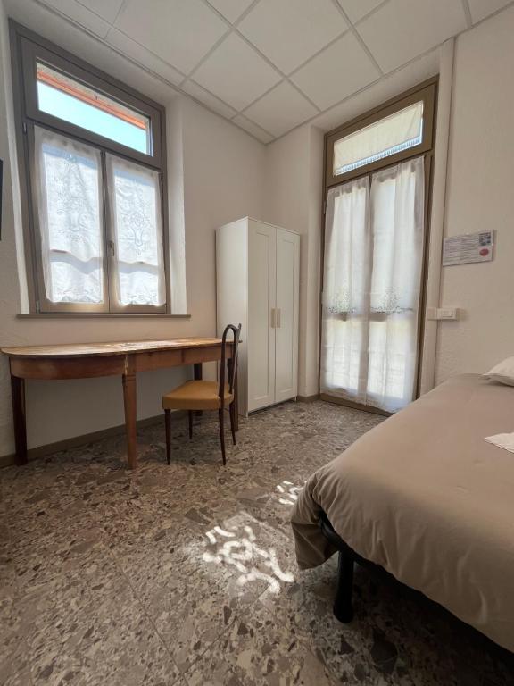 Postel nebo postele na pokoji v ubytování foresteria ca' mon