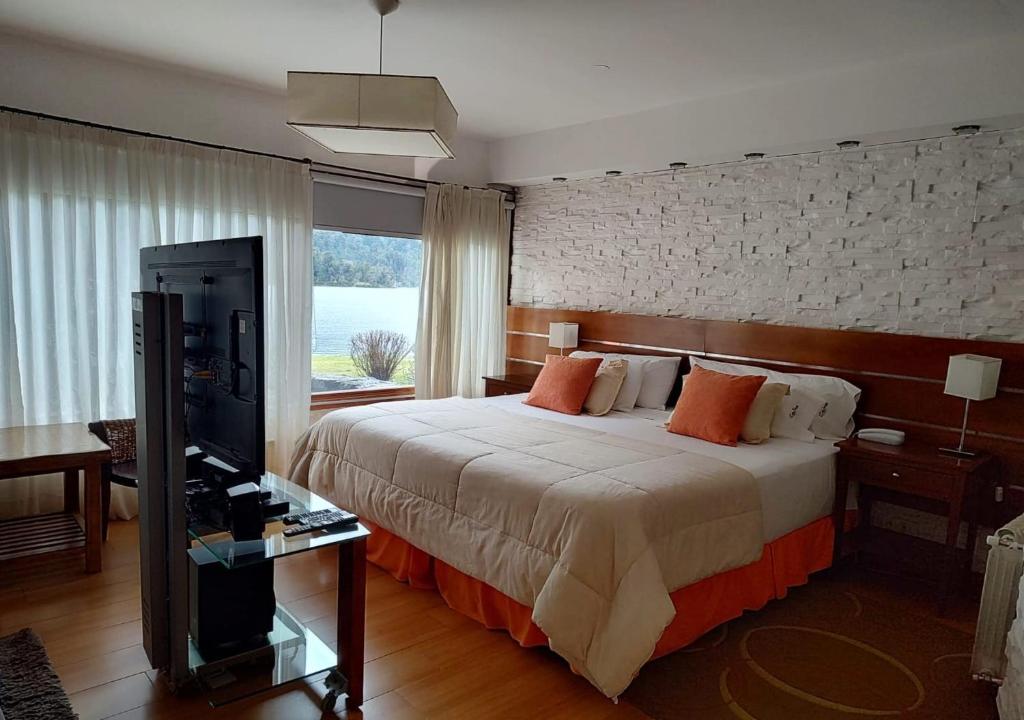 Postel nebo postele na pokoji v ubytování Costa Serena Aparts & Spa