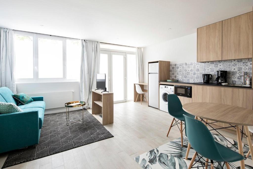 a kitchen and living room with a table and chairs at Louis Vicat 6 - CI - Ideal apartment for 4 Paris Expo Porte de Versailles in Paris