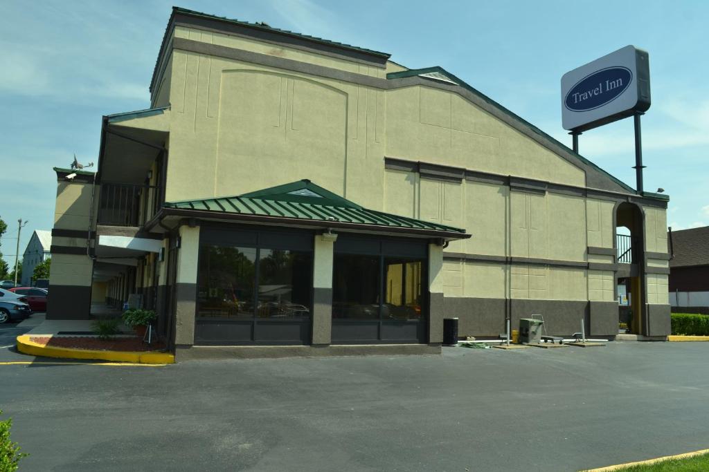 a building with a sign on the side of it at Travel Inn New Castle Airport in New Castle