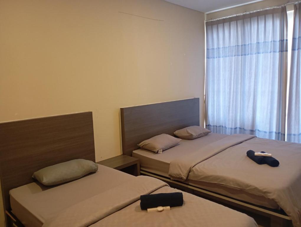 Postel nebo postele na pokoji v ubytování SleepRest @ NTC