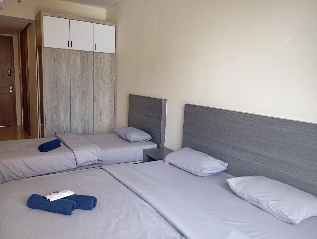 Postel nebo postele na pokoji v ubytování SleepRest @ NTC