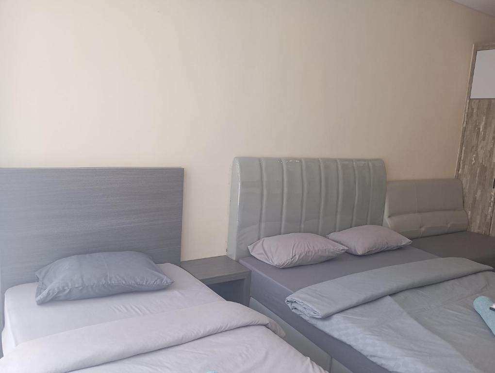 Postel nebo postele na pokoji v ubytování SleepRest @ NTC