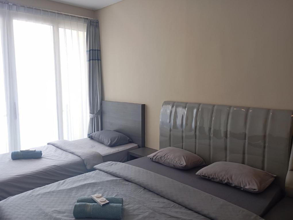 Postel nebo postele na pokoji v ubytování SleepRest @ NTC
