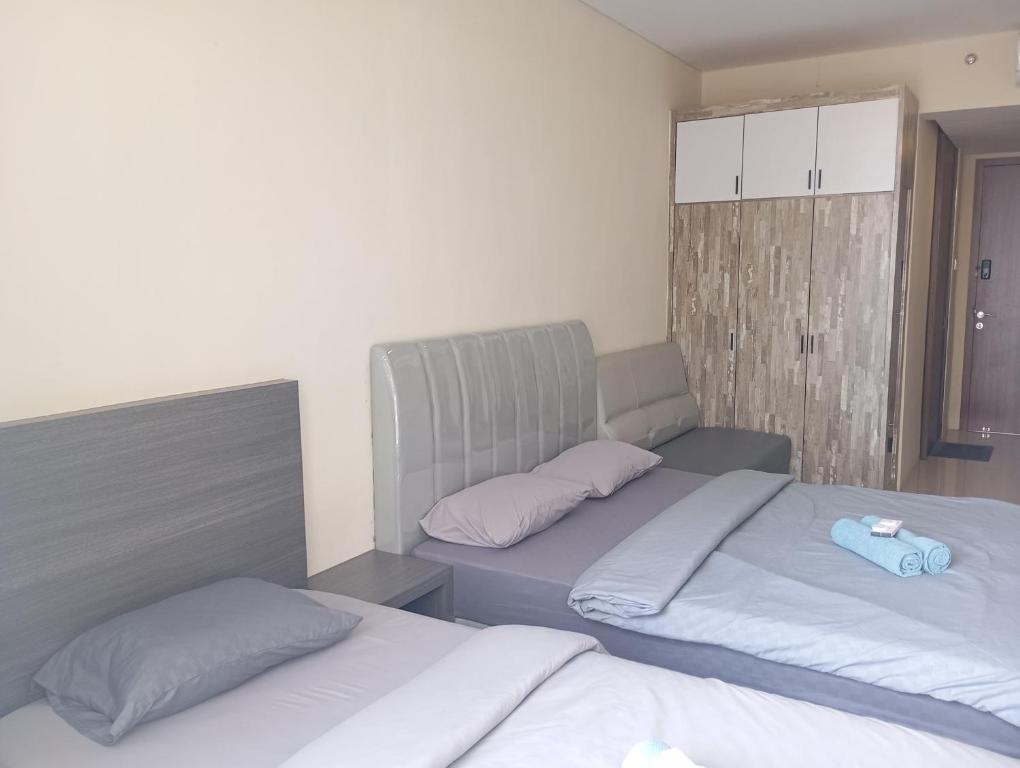Postel nebo postele na pokoji v ubytování SleepRest @ NTC