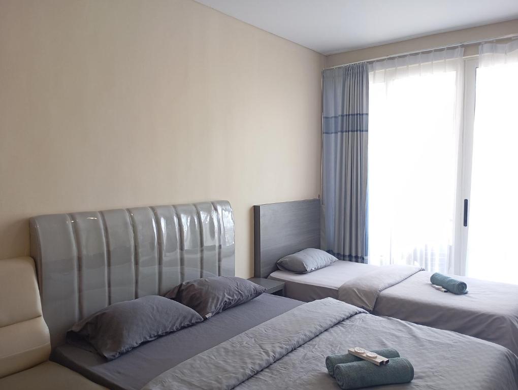 Postel nebo postele na pokoji v ubytování SleepRest @ NTC