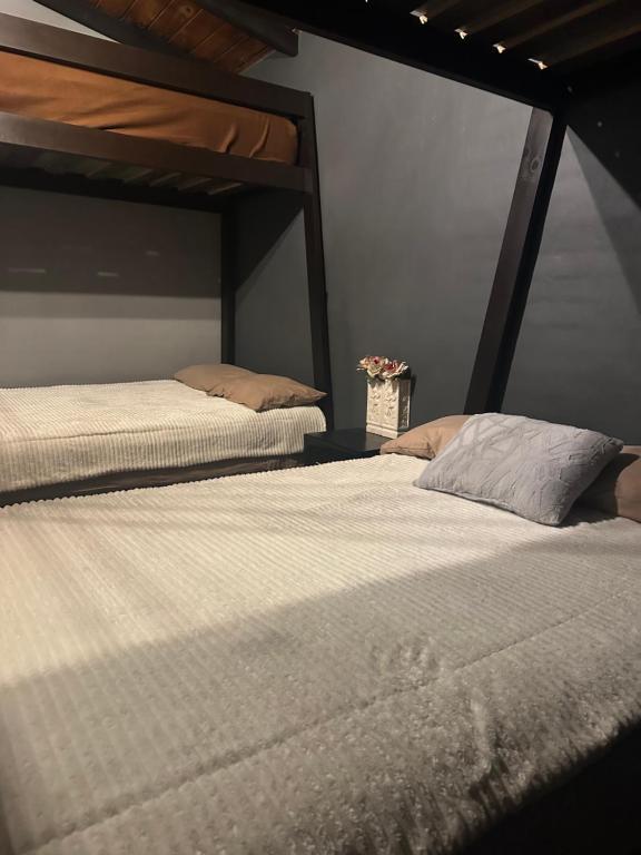 Postel nebo postele na pokoji v ubytování Cabaña DAGO