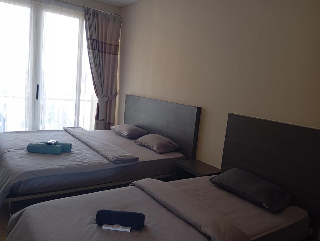 Postel nebo postele na pokoji v ubytování SleepRest @ NTC