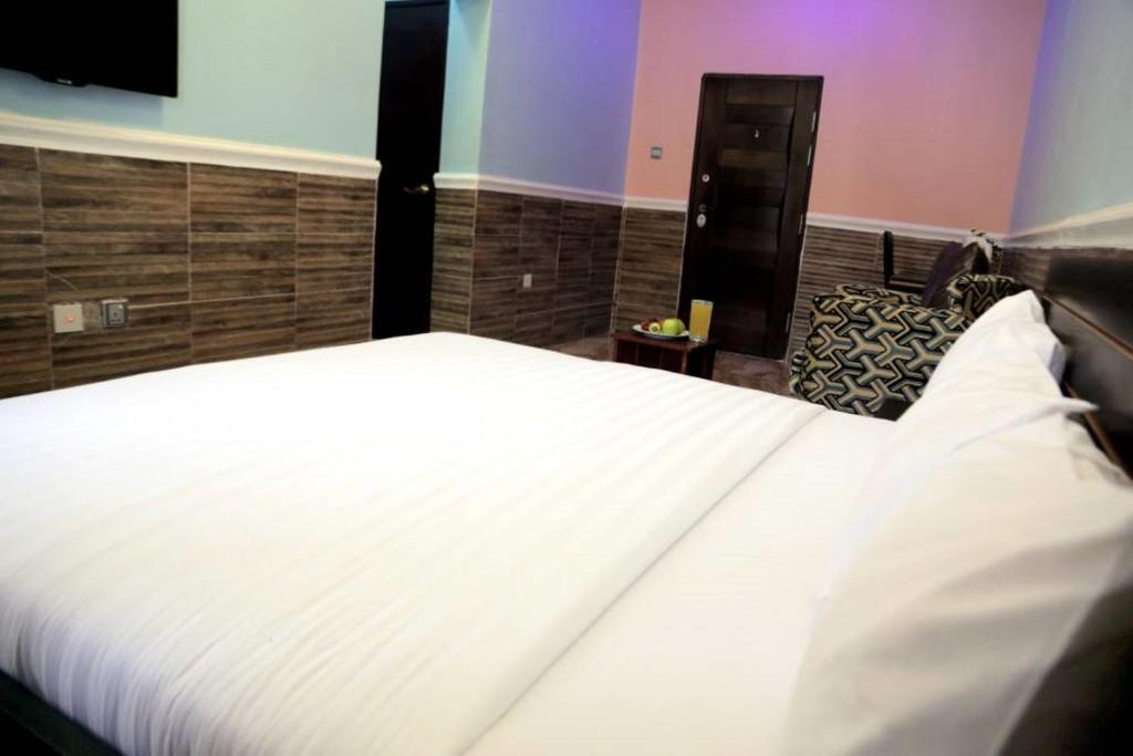 Postel nebo postele na pokoji v ubytování Dilida Hotel
