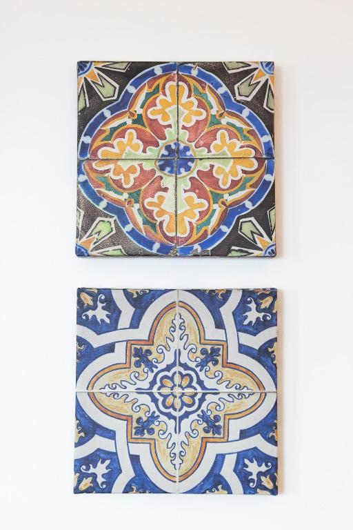 a set of three tiles with patterns on them at Casa Borda da Rocha in Nordeste