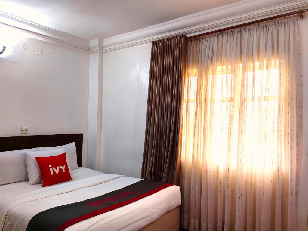 Postelja oz. postelje v sobi nastanitve Ivy Hotel Awolowo