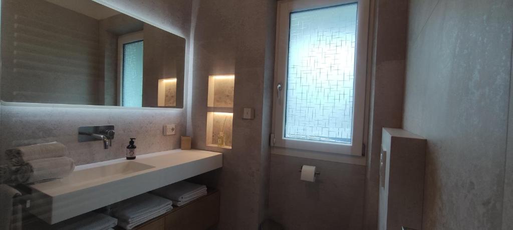Koupelna v ubytování Apartments Giovannini