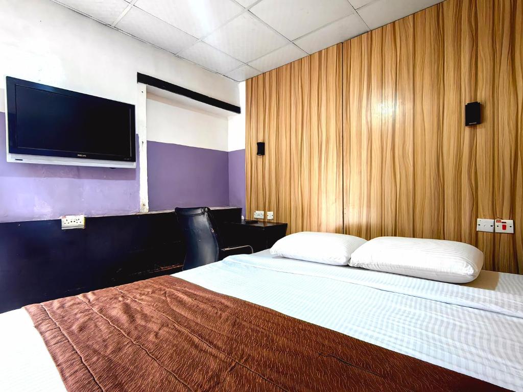 Postelja oz. postelje v sobi nastanitve Ivy Hotel Awolowo