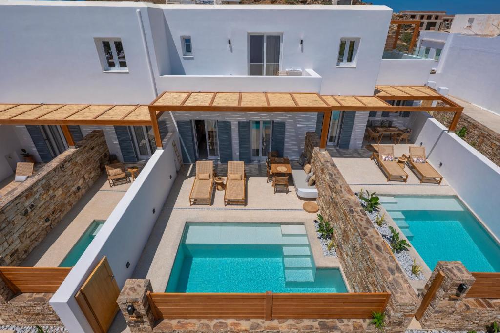 an aerial view of a villa with a swimming pool at Ios Art Suites in Ios Chora