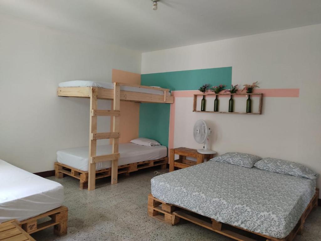 Postel nebo postele na pokoji v ubytování Hostal paz y vida
