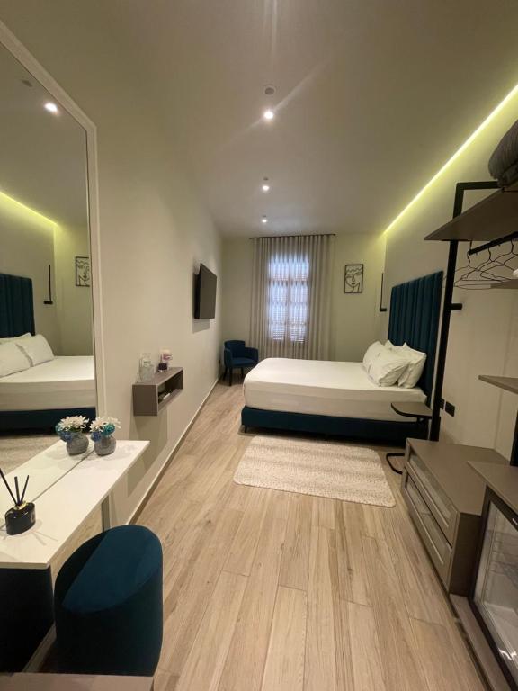 A bed or beds in a room at The cosy inn vlora