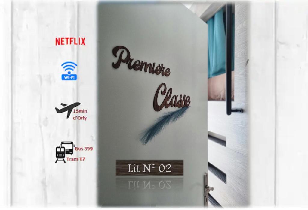 a door with a sign with a feather on it at Lit 2 en 1ère Classe-Orly-T7-RER C&D in Athis-Mons
