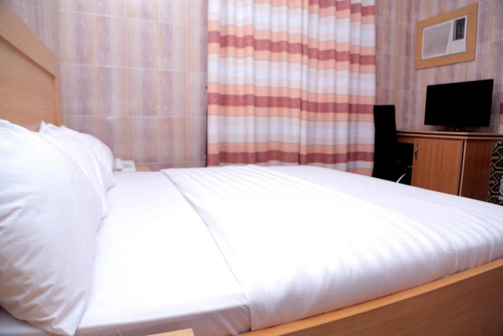 Postel nebo postele na pokoji v ubytování Dilida Hotel