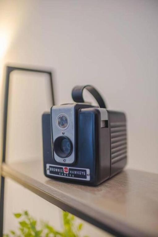 a radio sitting on a shelf next to a mirror at Casa Borda da Rocha in Nordeste