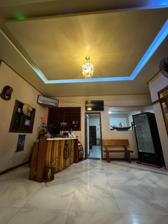 a living room with a ceiling with blue lights at Pousada Cabocla - Centro de Alter in Alter do Chao