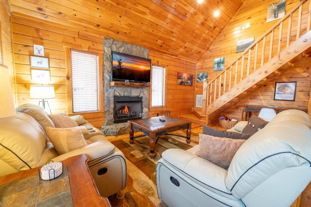 a living room with a couch and a fireplace at Rhythm & Blues By Avada Properties in Gatlinburg