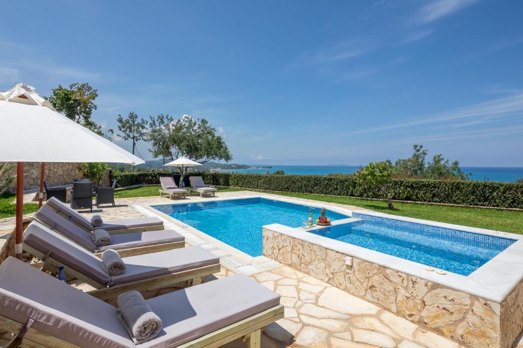 an image of a swimming pool in a villa at Villa Piedra Acharavi in Acharavi