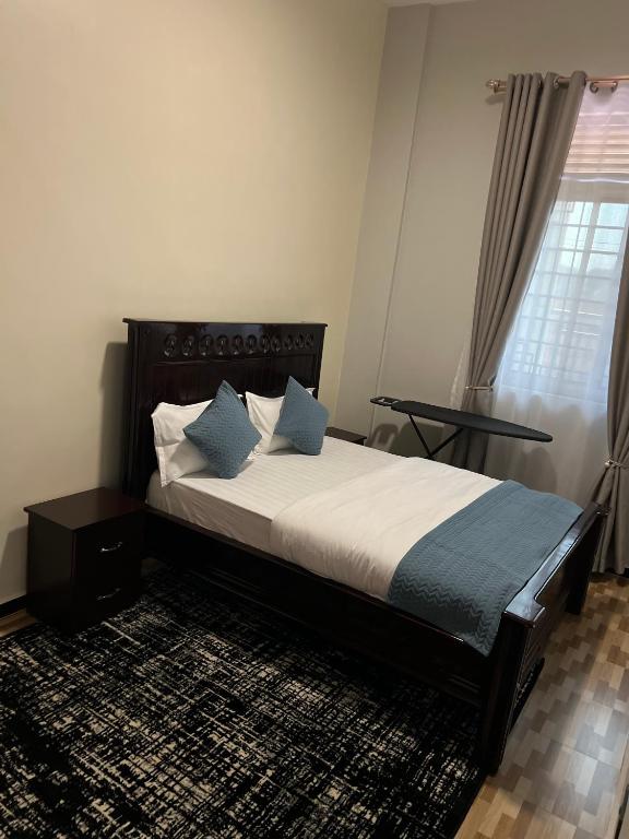 Postel nebo postele na pokoji v ubytování Rendezvous stayz