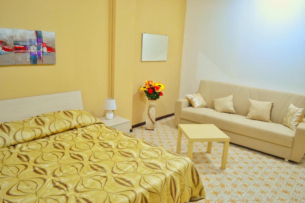 Ένα ή περισσότερα κρεβάτια σε δωμάτιο στο B&B Lungomare