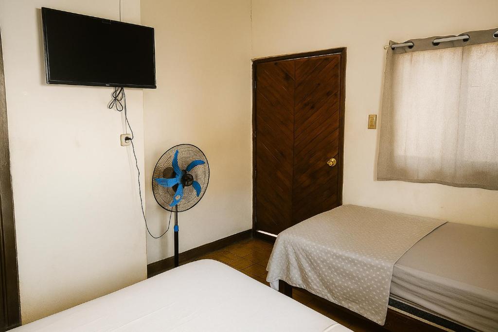 Postel nebo postele na pokoji v ubytování Hospedaje Casa Velaz
