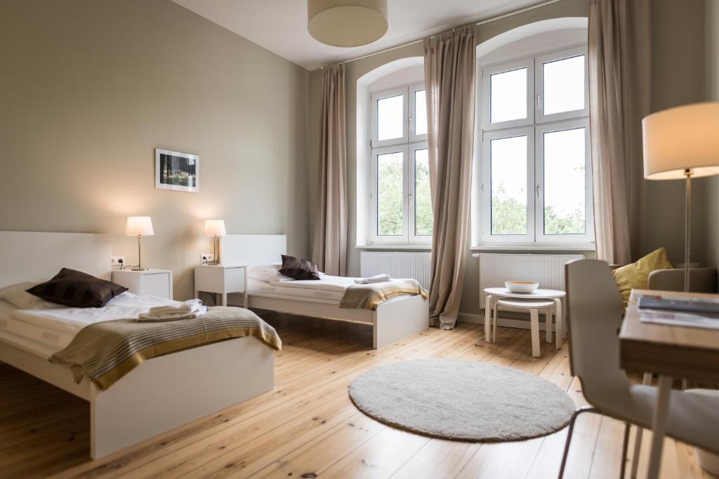 Postel nebo postele na pokoji v ubytování Johanniterhaus Wittenberg