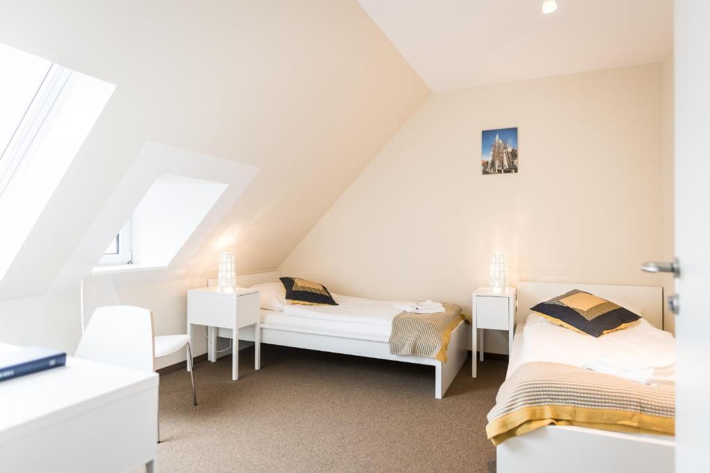 Postel nebo postele na pokoji v ubytování Johanniterhaus Wittenberg