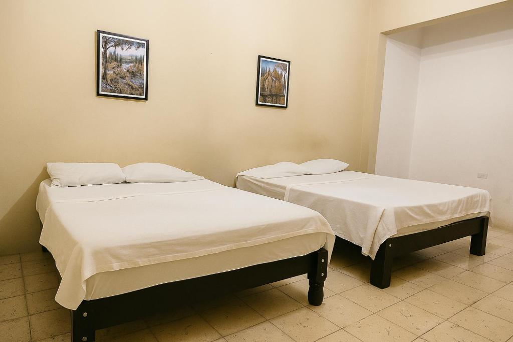 Postel nebo postele na pokoji v ubytování Hospedaje Casa Velaz