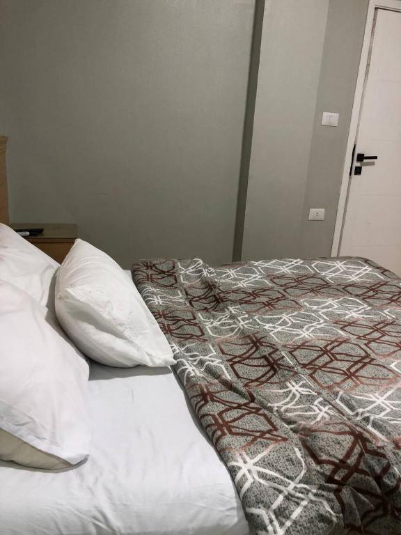 Postel nebo postele na pokoji v ubytování Sky pyramids iNN