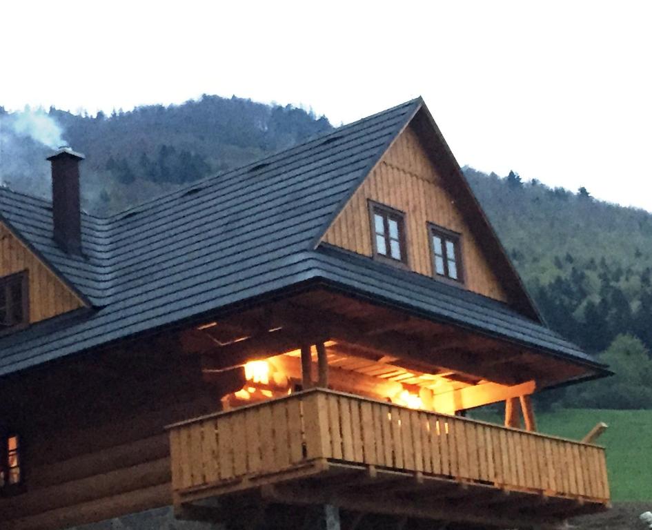 a large log cabin with lights in the windows at Drevenica u Michala in Terchová