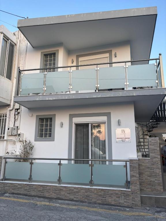 a building with a balcony on the side of it at Haraki Beauty in Haraki