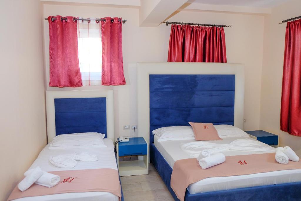 Postel nebo postele na pokoji v ubytování Laid Hotel