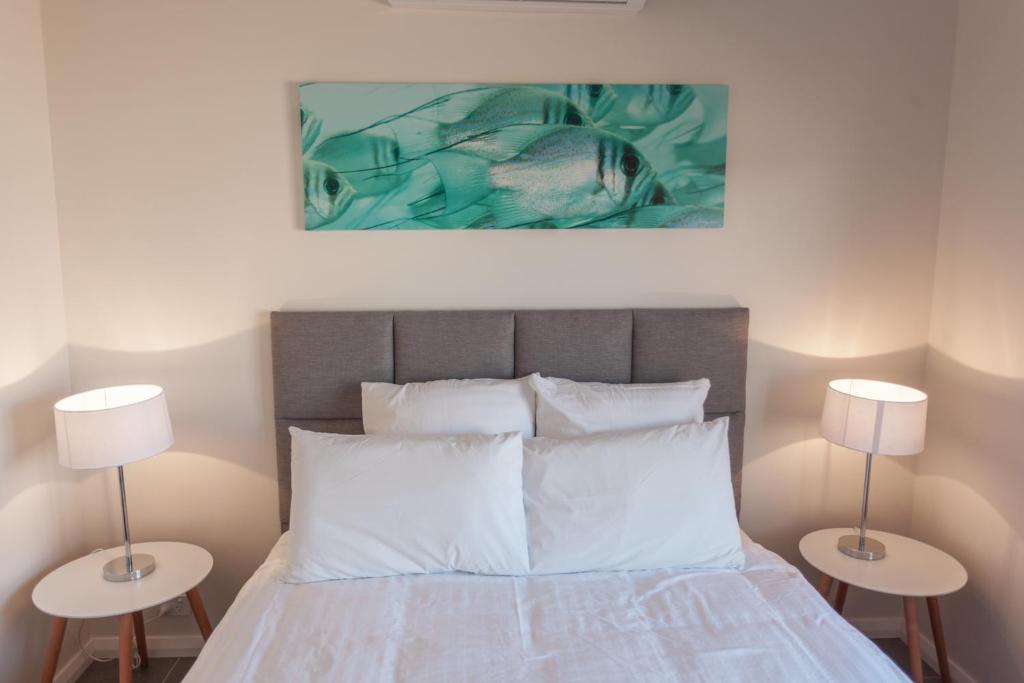 Postel nebo postele na pokoji v ubytování Exmouth Escape Resort