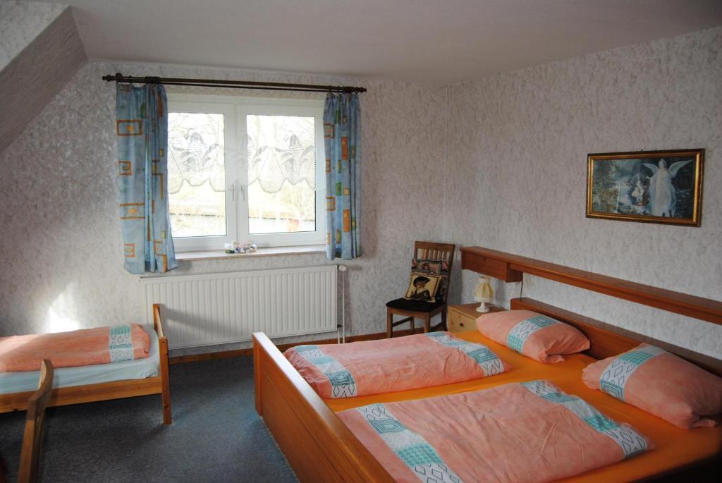 Postel nebo postele na pokoji v ubytování Schule 5