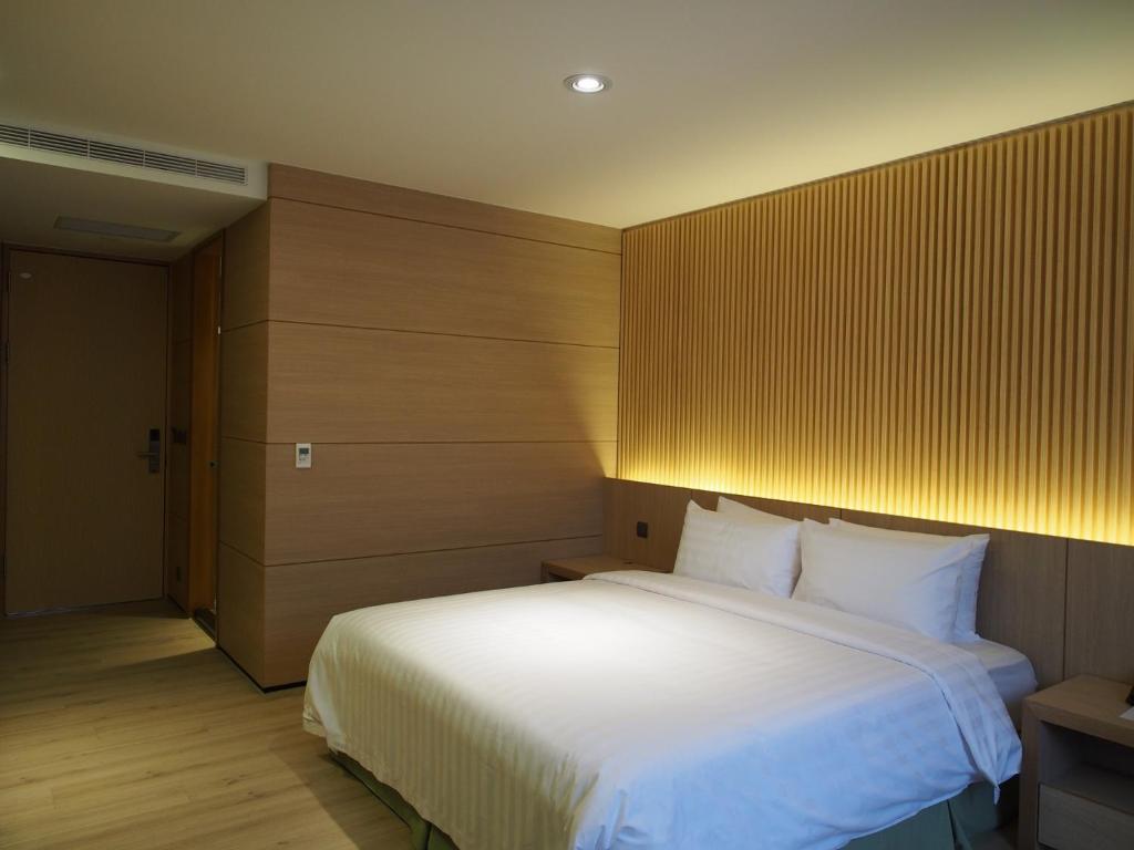 Postel nebo postele na pokoji v ubytování Hotel R14