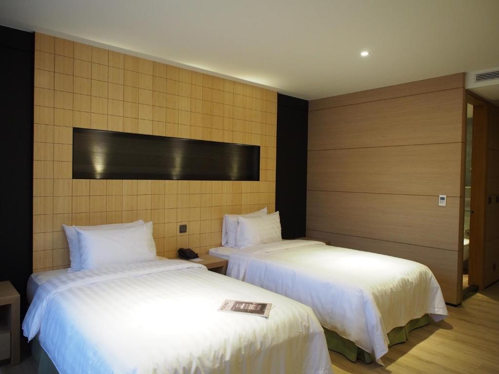 Postel nebo postele na pokoji v ubytování Hotel R14