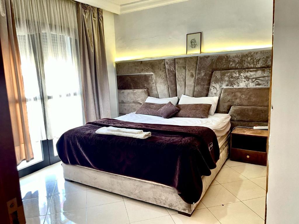 a bedroom with a large bed in a room at Appart G7 loca in Agadir