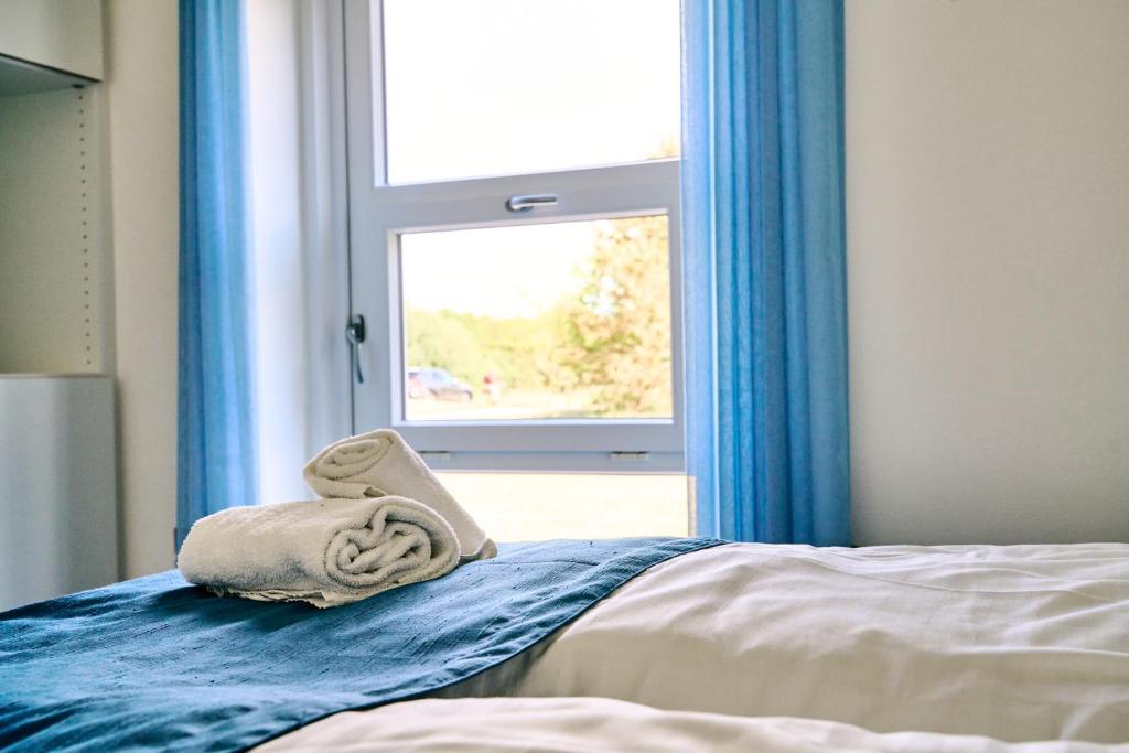 Postel nebo postele na pokoji v ubytování Hotel Hvideklit