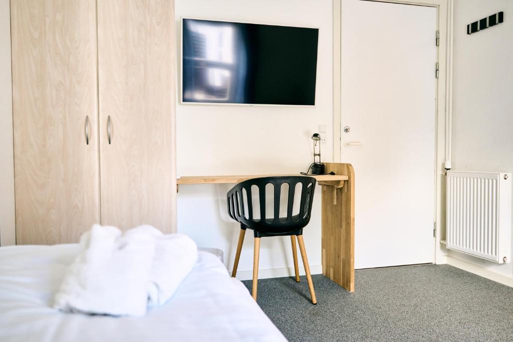 Postel nebo postele na pokoji v ubytování Hotel Hvideklit