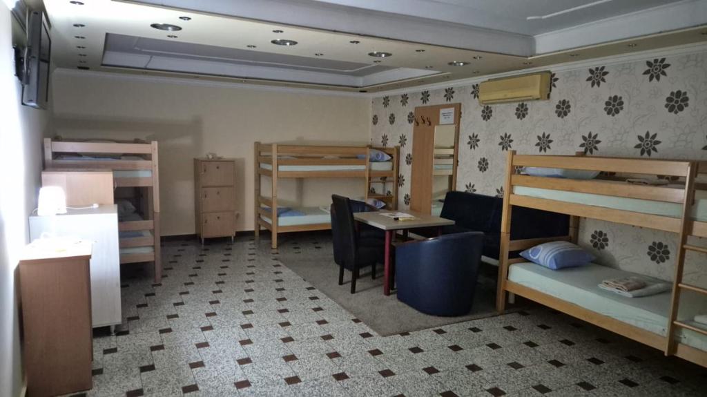 Postel nebo postele na pokoji v ubytování Hostel Dino