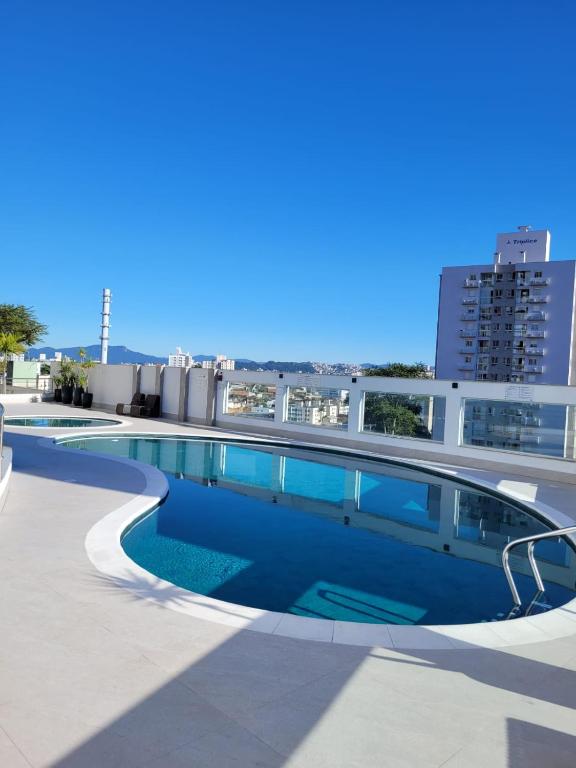 a swimming pool on the roof of a building at Ap Royal Mirage in Florianópolis