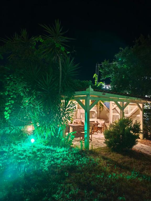 a gazebo and a picnic table at night at The Archontariki in Ormos Panagias