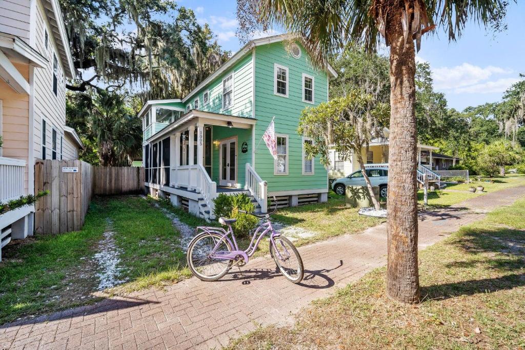 a bike parked in front of a house at Oystershell Cottage in Port Royal
